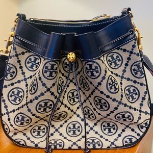 Tory Burch Navy T Monogram Jacquard Drawstring Shoulder Bag w/ crossbody strap.